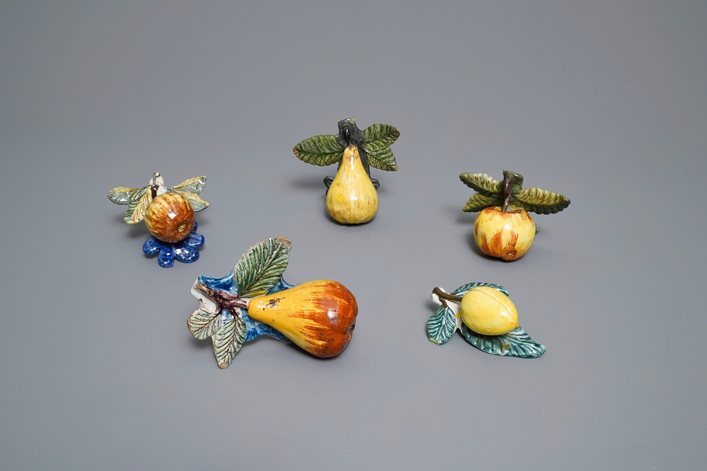 Five polychrome Dutch Delft models of apples, pears and a plum, 18th C.