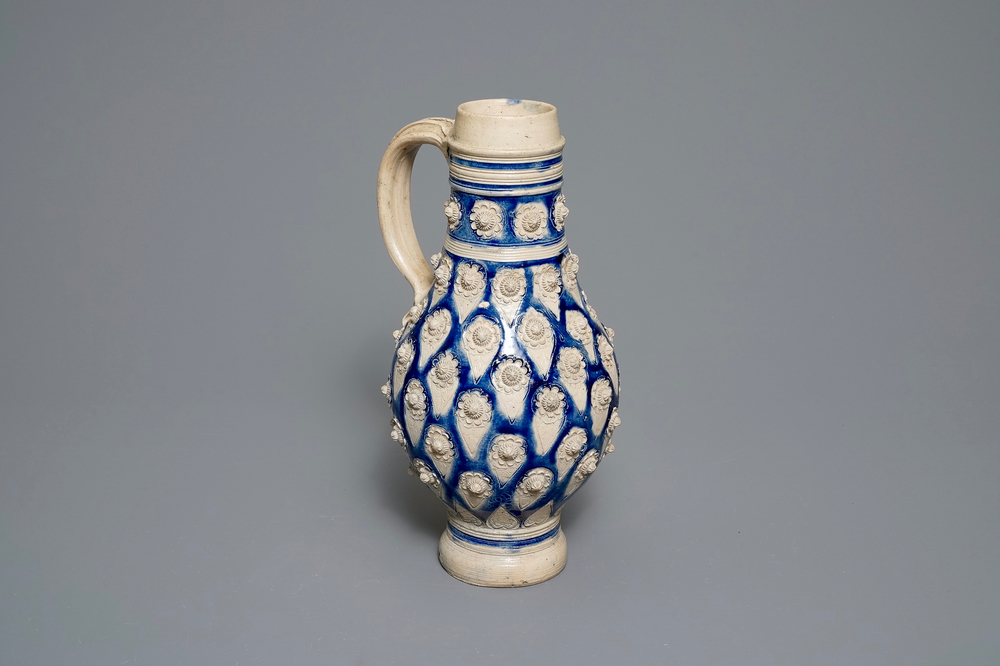 A large German stoneware jug with applied floral design, Westerwald, 17th C.