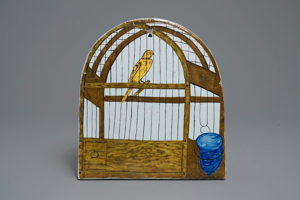 Une plaque en fa&iuml;ence polychrome de Delft &agrave; d&eacute;cor trompe l'oeil d'un cage &agrave; oiseaux, 18&egrave;me