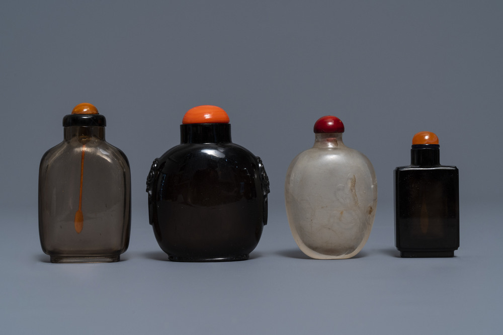 Four Chinese smoky quartz and simulating glass snuff bottles, 18/19th C.