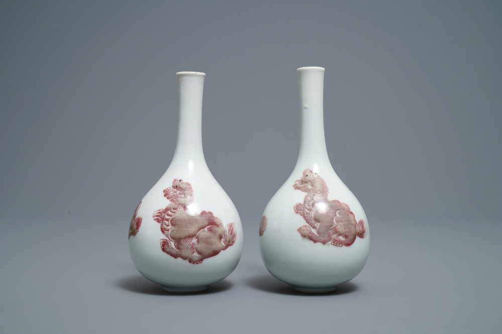 A pair of Chinese copper red 'mythical beasts' vases, Kangxi