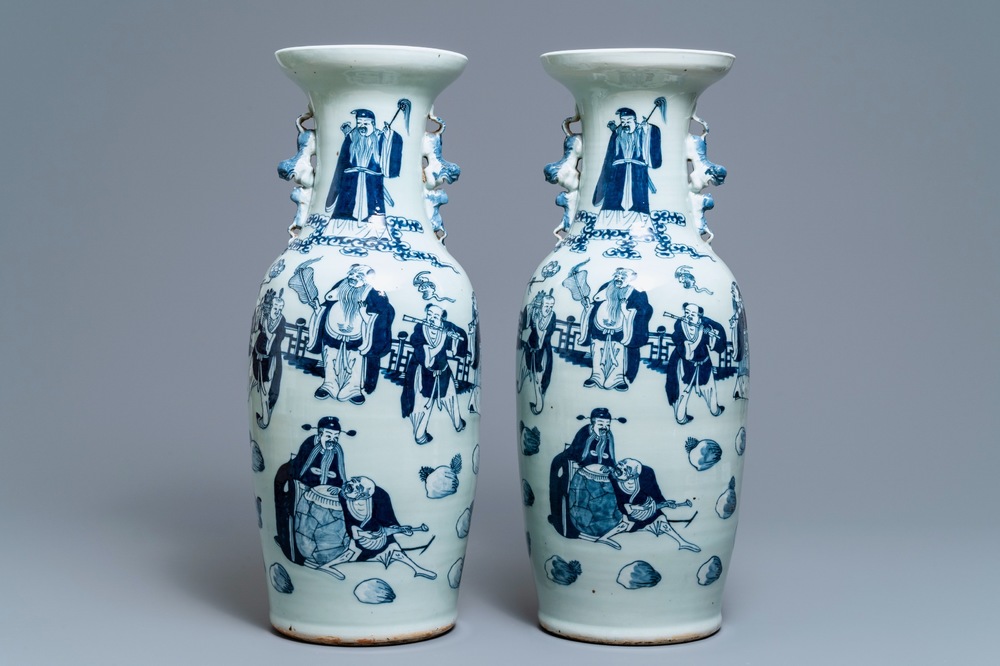 A pair of Chinese blue and white celadon vases with figures, 19th C.