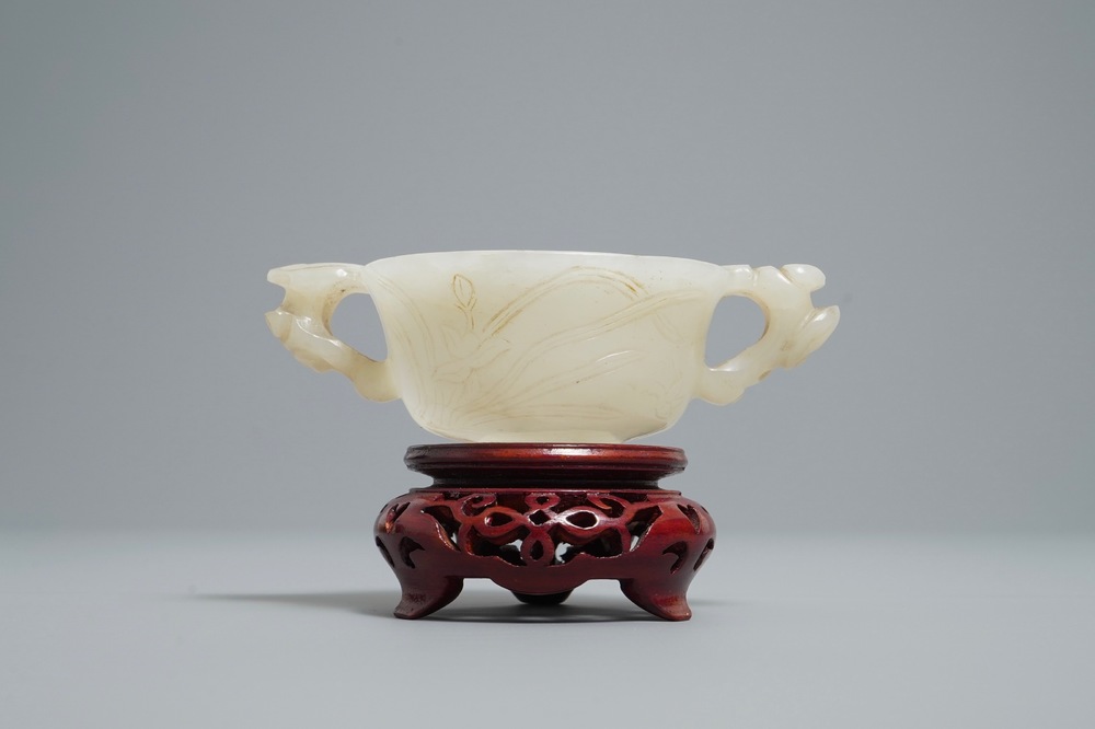 A Chinese pale celadon jade libation cup, 18/19th C.