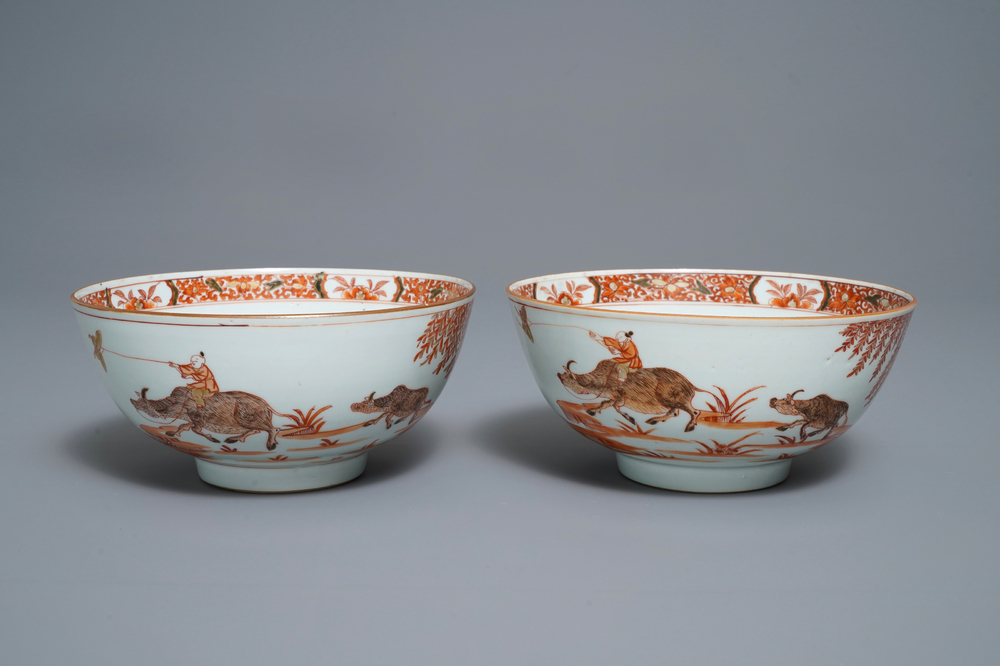 A pair of Chinese iron red bowls with a kiting boy on an ox, Yongzheng