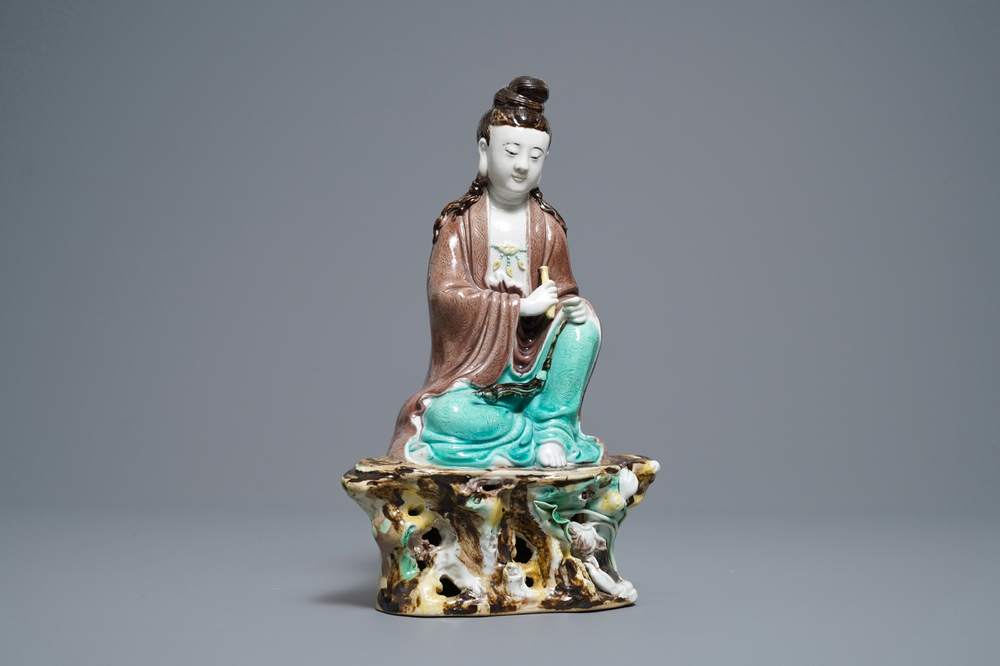 A Chinese verte biscuit figure of Buddha seated on a rock, seal mark, Republic