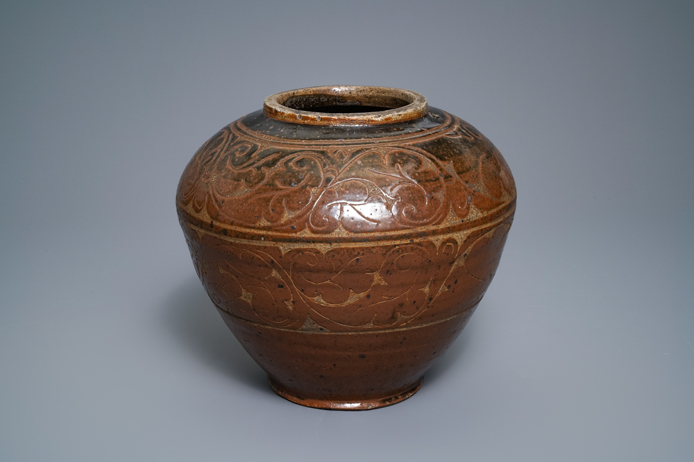 A Chinese brown-glazed cizhou jar with incised design, Yuan