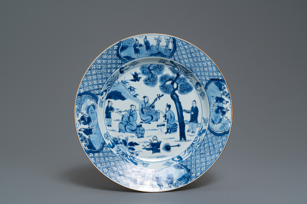 A Chinese blue and white dish with musicians in a garden, Kangxi