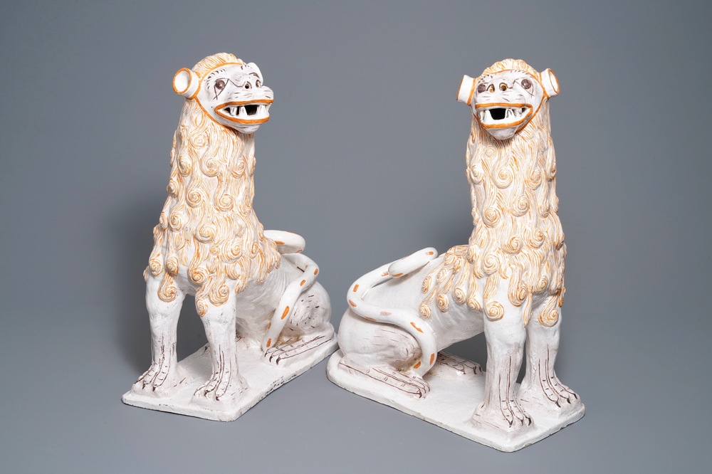 An impressive pair of large Portuguese faience models of lions, 18th C.
