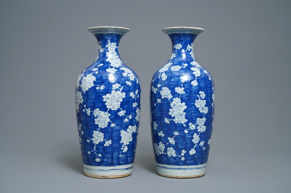 A pair of Chinese blue and white 'prunus on cracked ice' vases, 19th C.