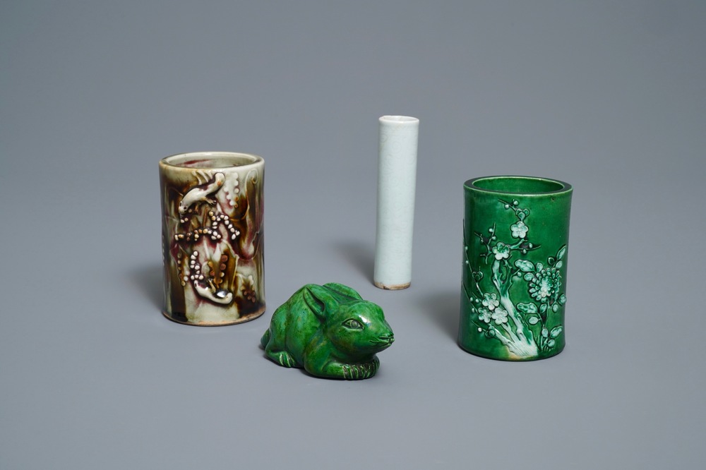 Two Chinese monochrome relief-decorated brush pots, an incense tube and a rabbit, 18/19th C.