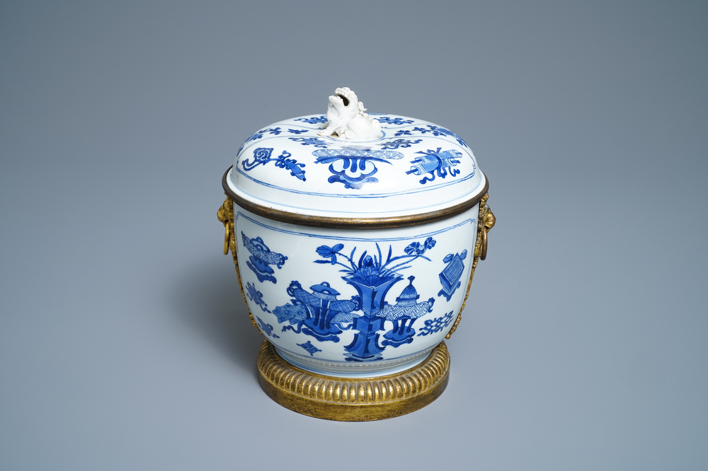A Chinese blue and white bowl and cover with gilt bronze mounts, Kangxi