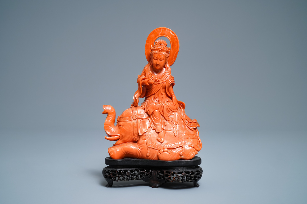 A Chinese carved red coral group of Guanyin on an elephant, 19th C.