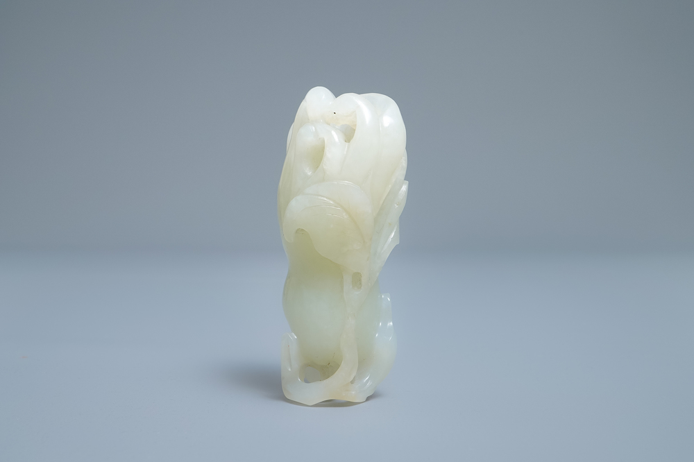 A Chinese celadon jade 'Buddha hand' carving, 19th C.