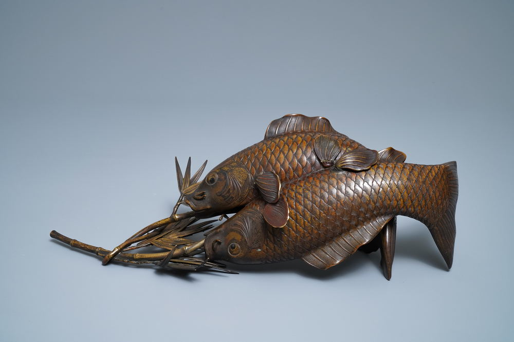 A Japanese bronze group depicting two koi fish, Meiji, 19th C.