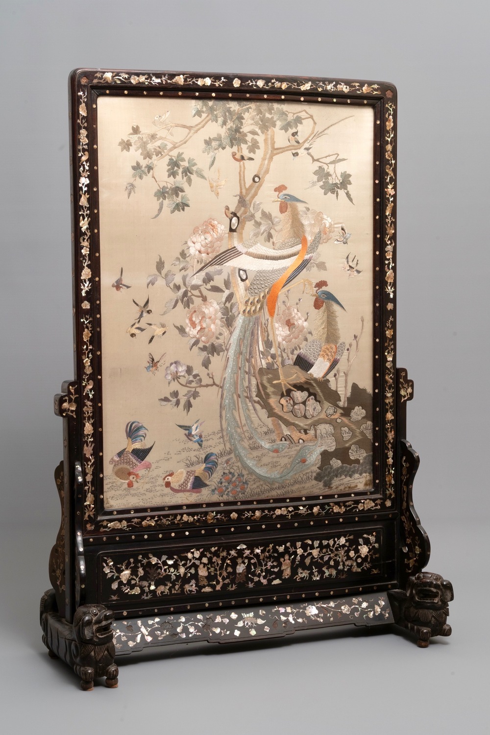 A large Chinese mother-of-pearl-inlaid wooden screen with silk embroidery, 19th C.