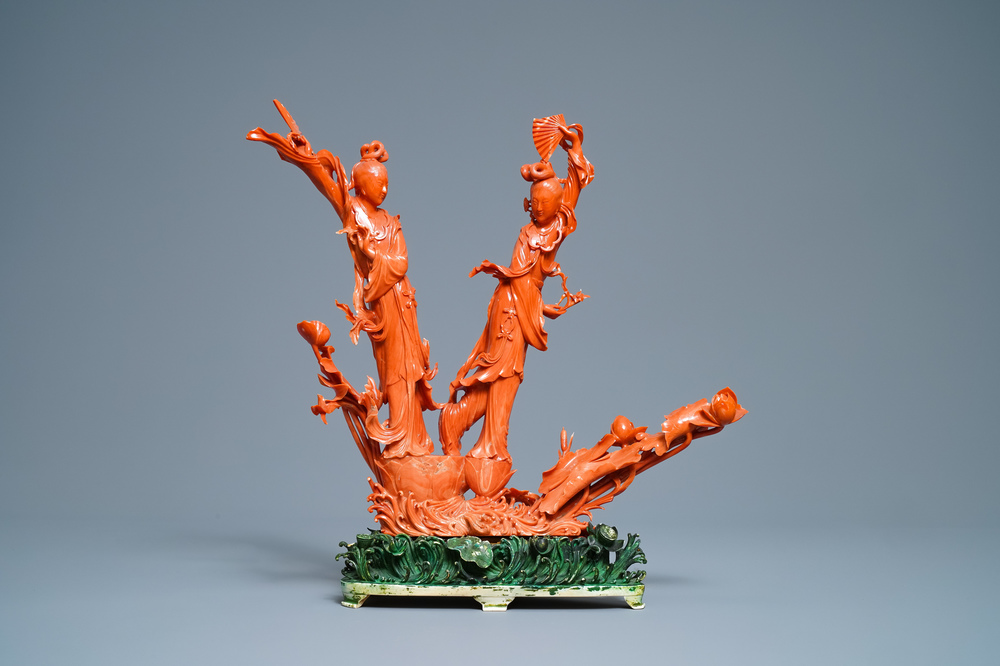 A large Chinese carved red coral group of two ladies with fans, 19th C.