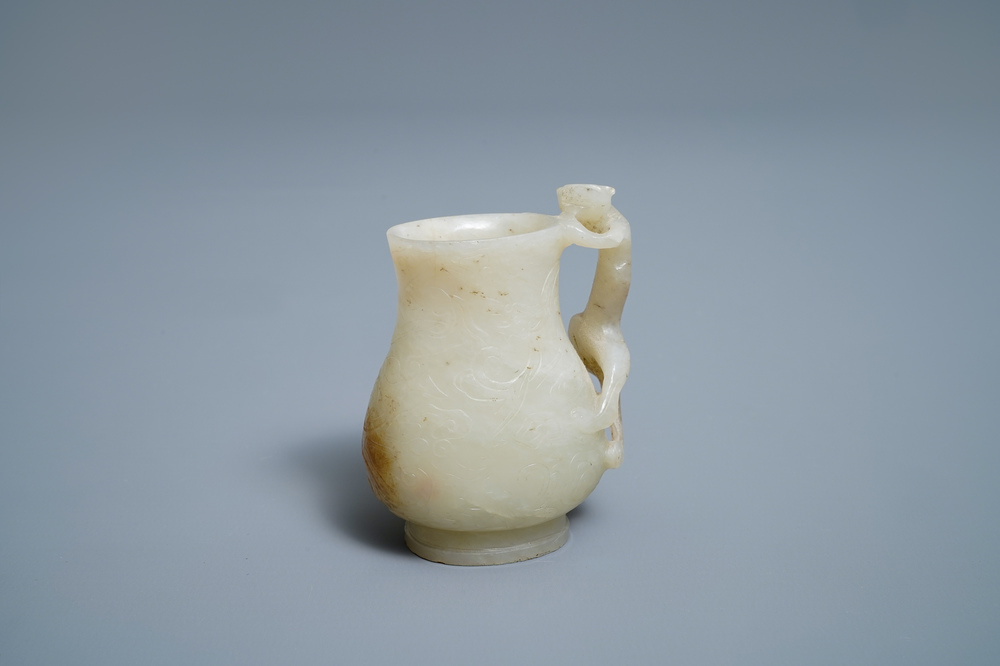 A Chinese celadon russet jade chilong-handled jug, Qing