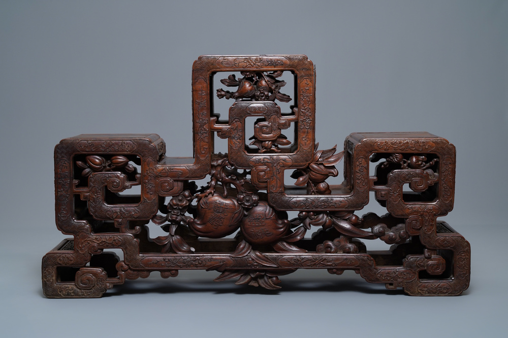 A Chinese finely carved wooden display stand, 19th C.