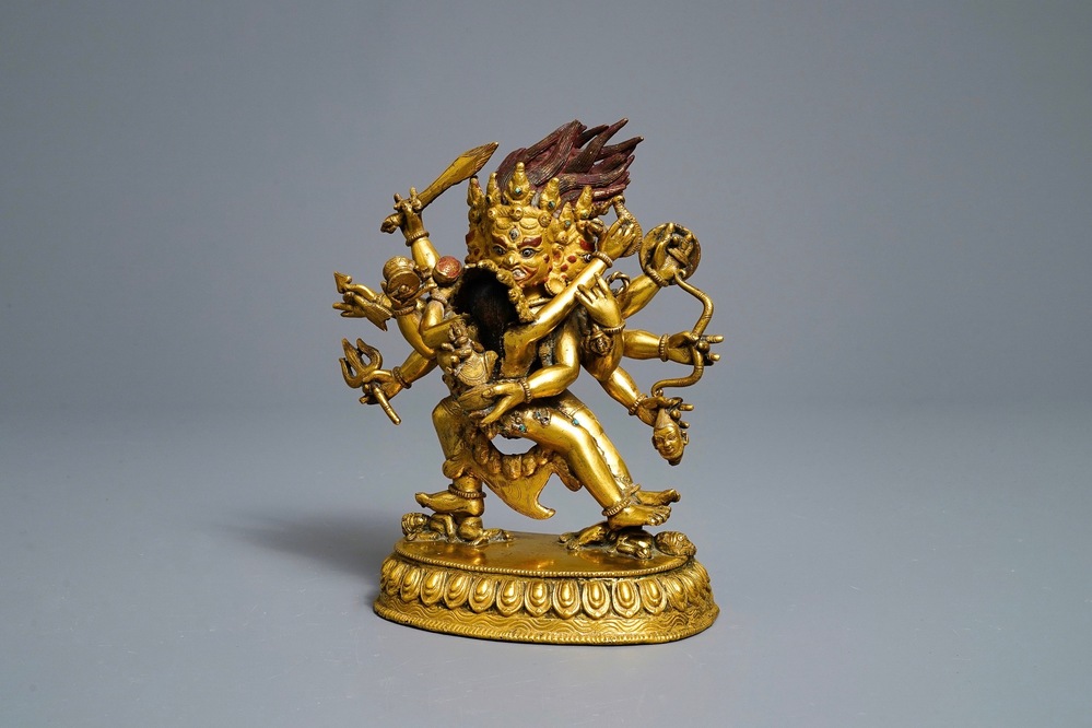 A Sino-Tibetan gilt bronze group of Mahakala and his consort Yab-Yum, 19th C.