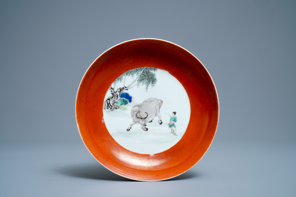 A Chinese famille verte coral-ground 'buffalo shepherd' plate, Yongzheng mark and of the period