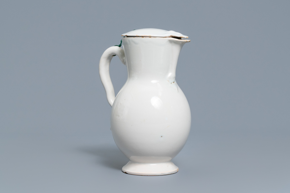 A white Delftware jug and cover, France, 18th C.