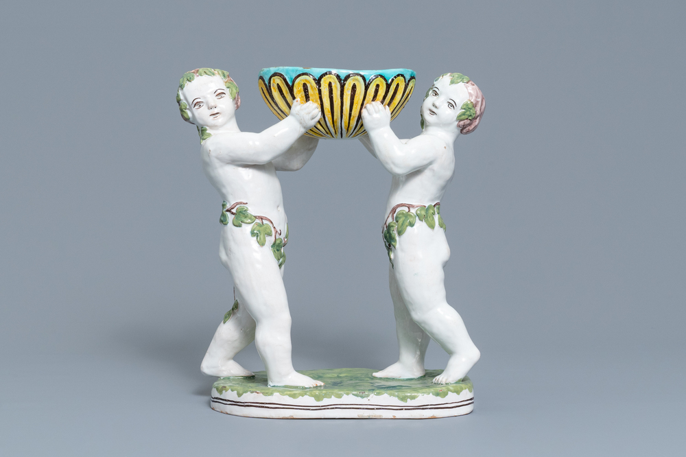 A polychrome faience group with two Bacchus figures, Geo Martel, D&egrave;svres, early 20th C.