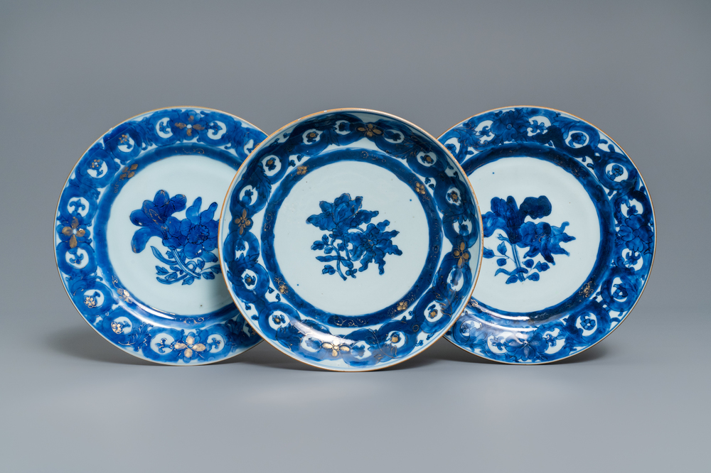Three Chinese gilt-decorated blue and white plates, Qianlong