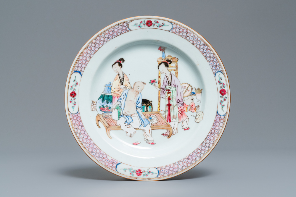 A fine Chinese famille rose ruby back plate with figures in an interior, Yongzheng