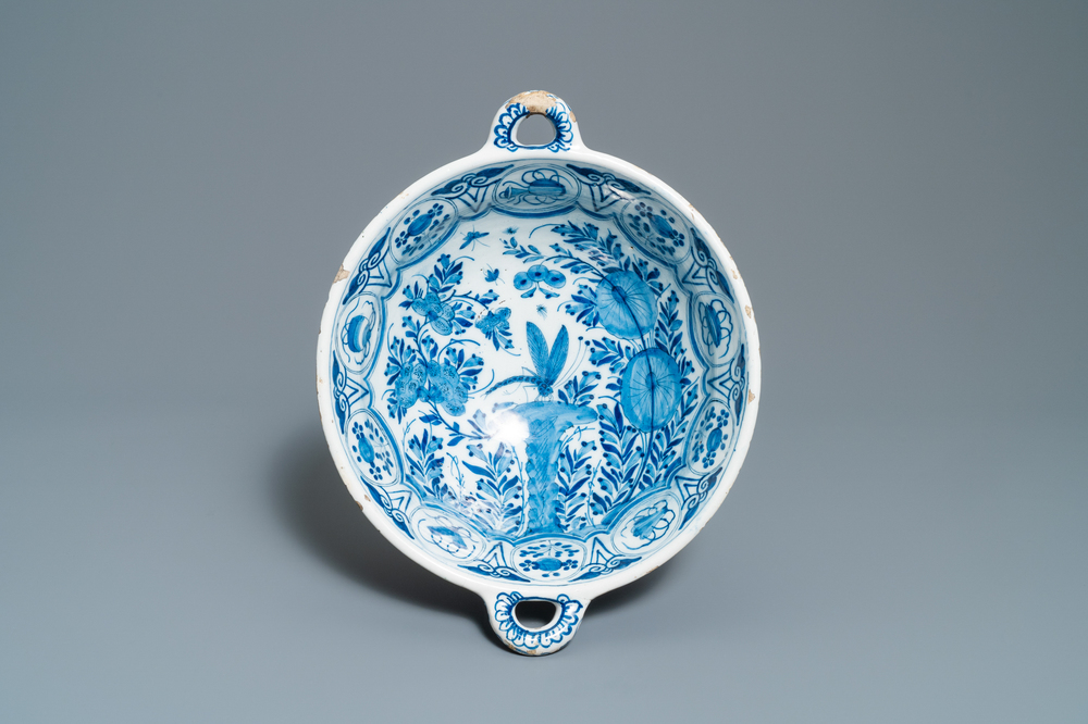 A large Dutch Delft blue and white two-handled chinoiserie bowl, 18th C.