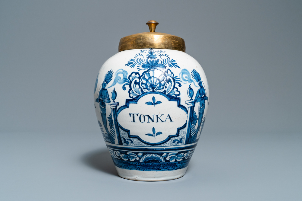 A Dutch Delft blue and white tobacco jar with American Indians and inscribed 'Tonka', 18th C.