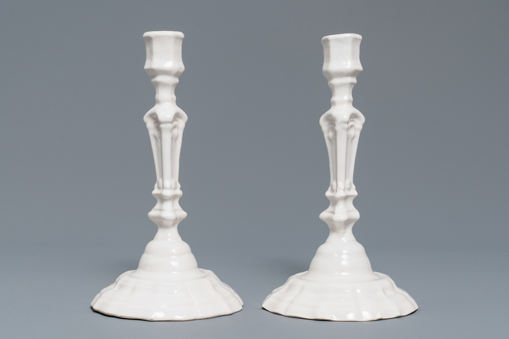 A pair of white Delftware candlesticks, 18th C.