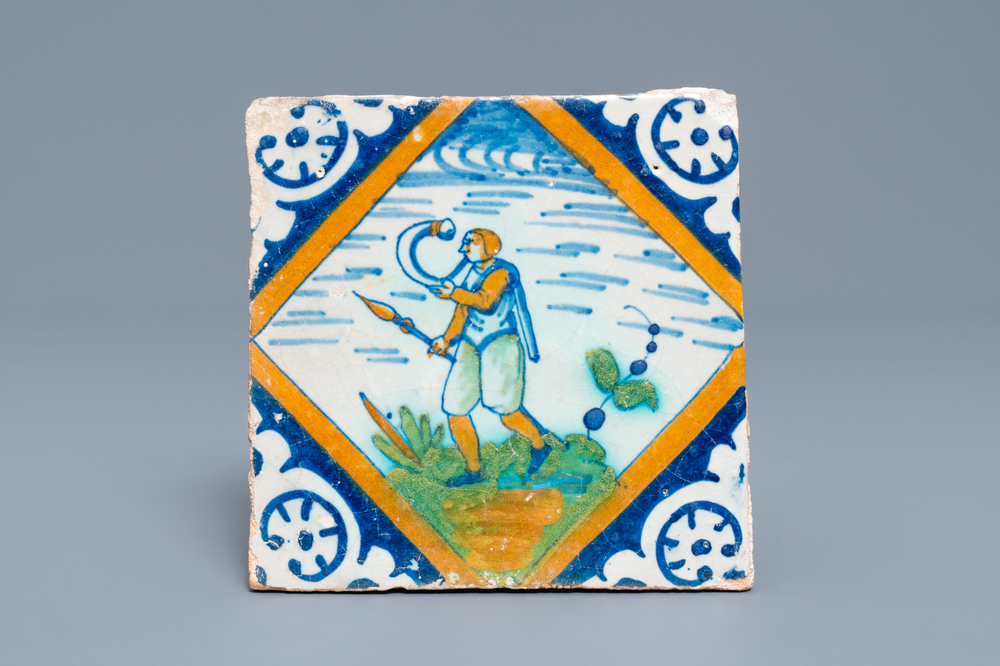 A polychrome Dutch Delft maiolica tile with a hornblower, ca. 1600