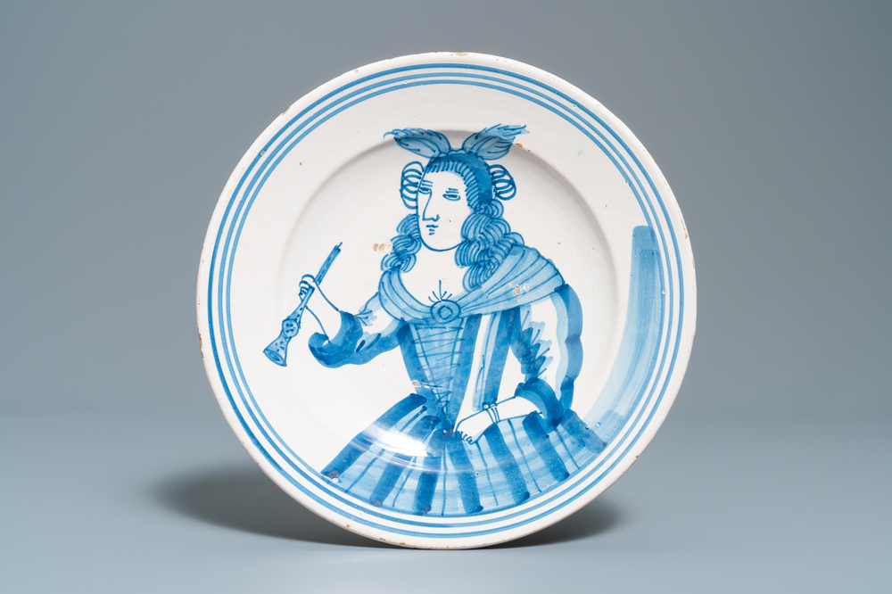 A blue and white dish with an allegorical depiction of the hearing, Makkum, 1st half 18th C.