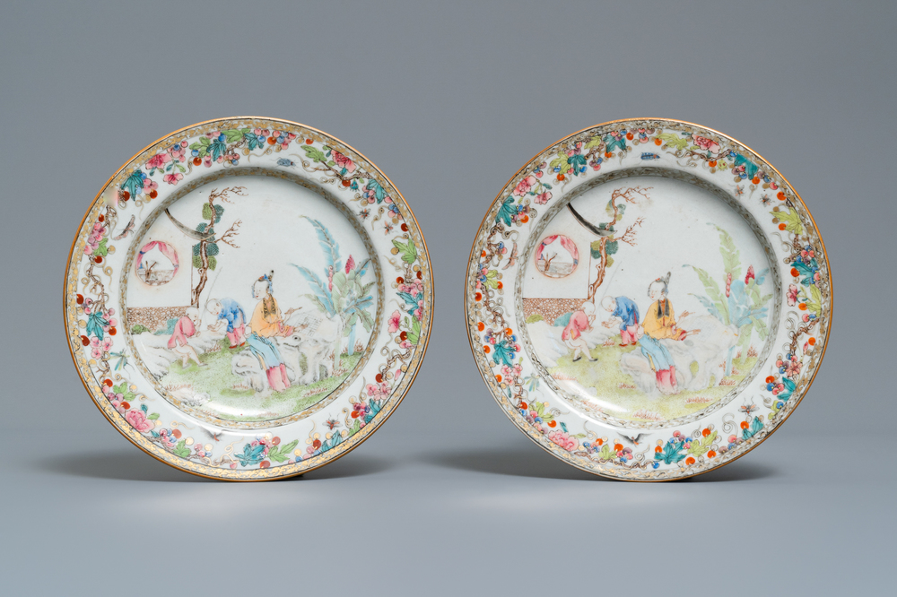 A pair of Chinese famille rose plates with figures in a garden, Yongzheng