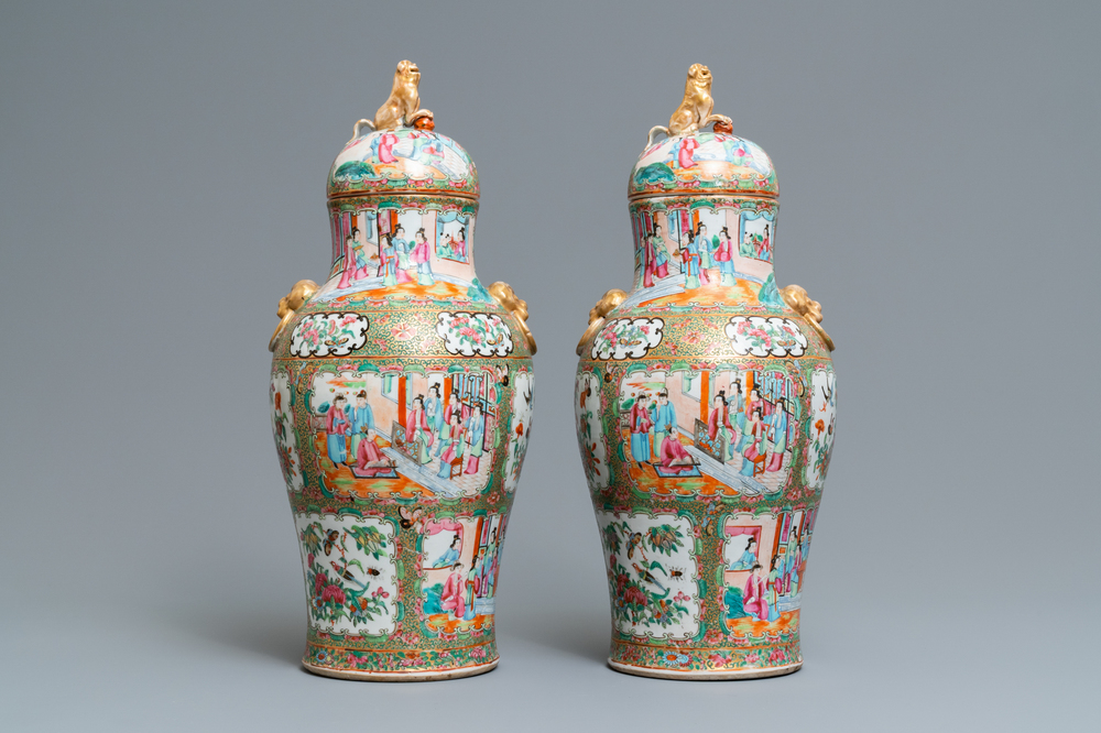 A pair of Chinese Canton famille rose vases and covers, 19th C.