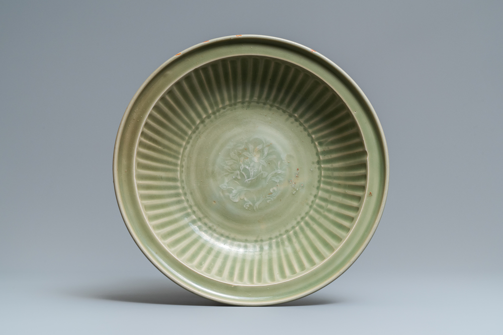 A Chinese Longquan celadon dish with incised floral design, Ming