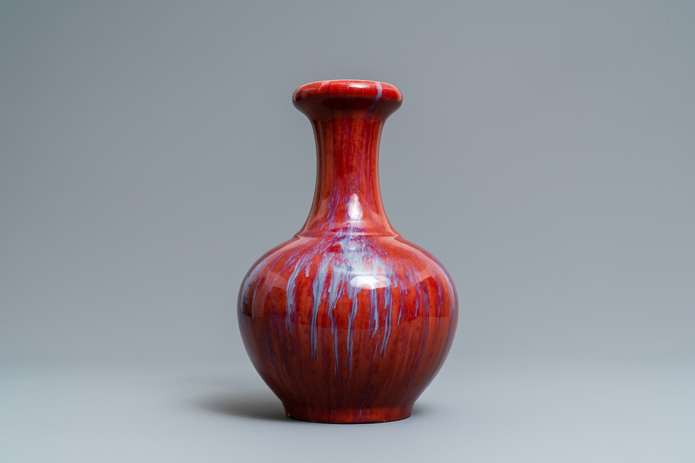 A Chinese monochrome flamb&eacute; sang-de-boeuf bottle vase, 19th C.