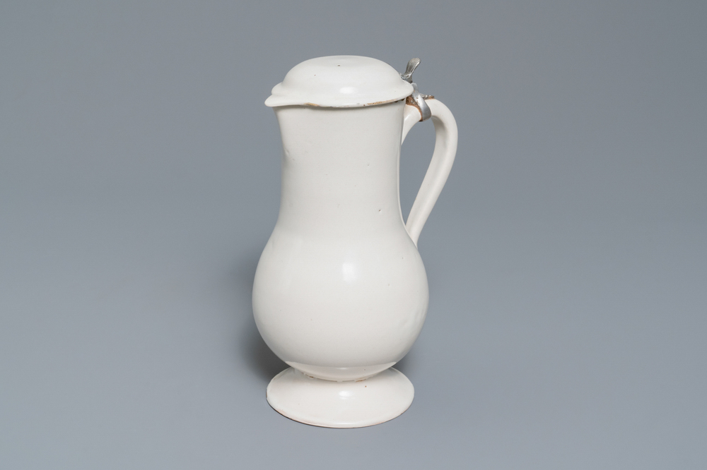 A white Delftware jug and cover, 18th C.