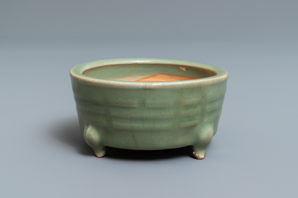 A Chinese Longquan celadon tripod censer with trigrams, Ming