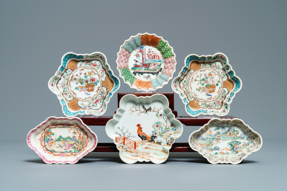 Three Chinese famille rose teapot stands, two spoon trays and a saucer, Yongzheng/Qianlong