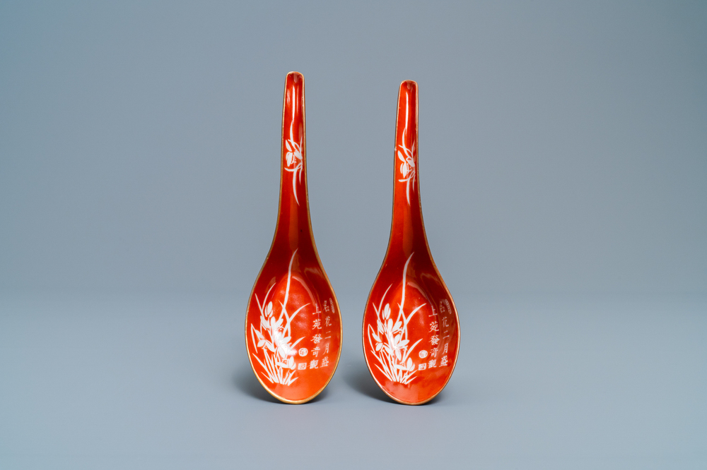 A pair of Chinese reverse-decorated iron red spoons, 19th C.