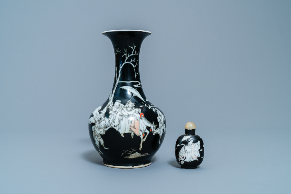 A Chinese black-ground grisaille and iron red vase and a snuff bottle, 18th C.