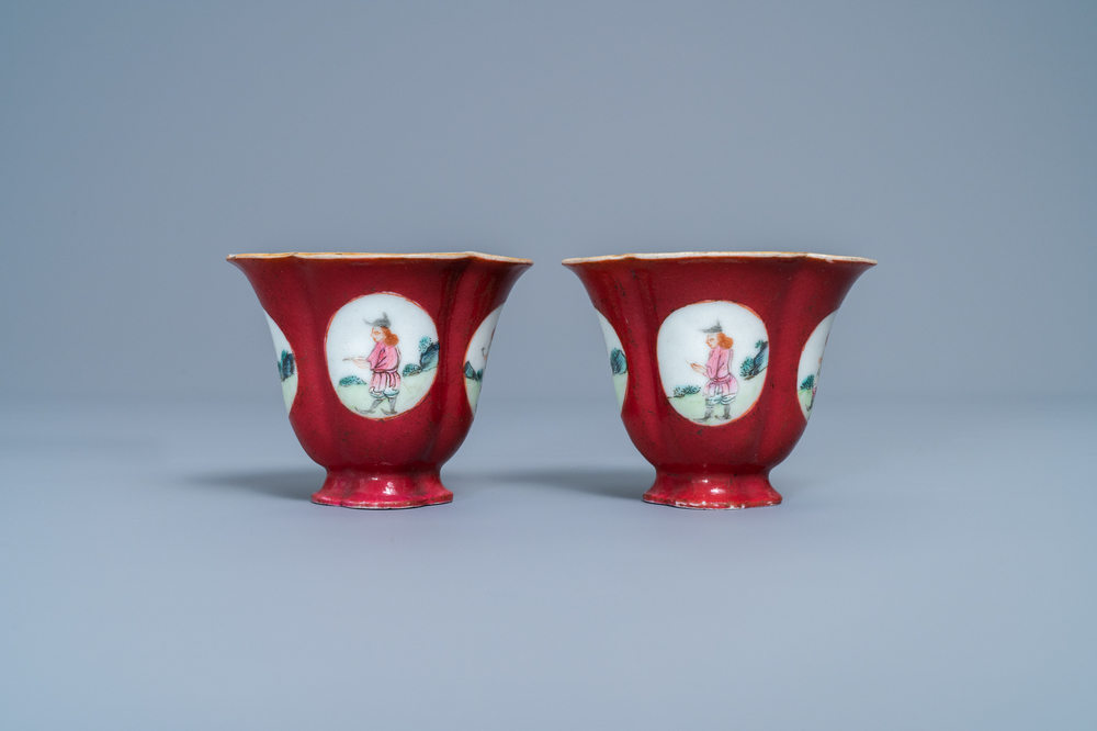 A pair of Chinese famille rose ruby-ground wine cups with foreigners, Qianlong