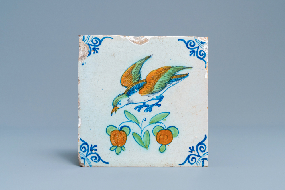 A polychrome Dutch Delft tile with a bird in flight, 17th C.
