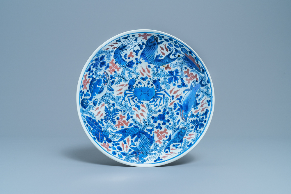 A Chinese blue, white and copper red 'crab and fish' dish, Kangxi