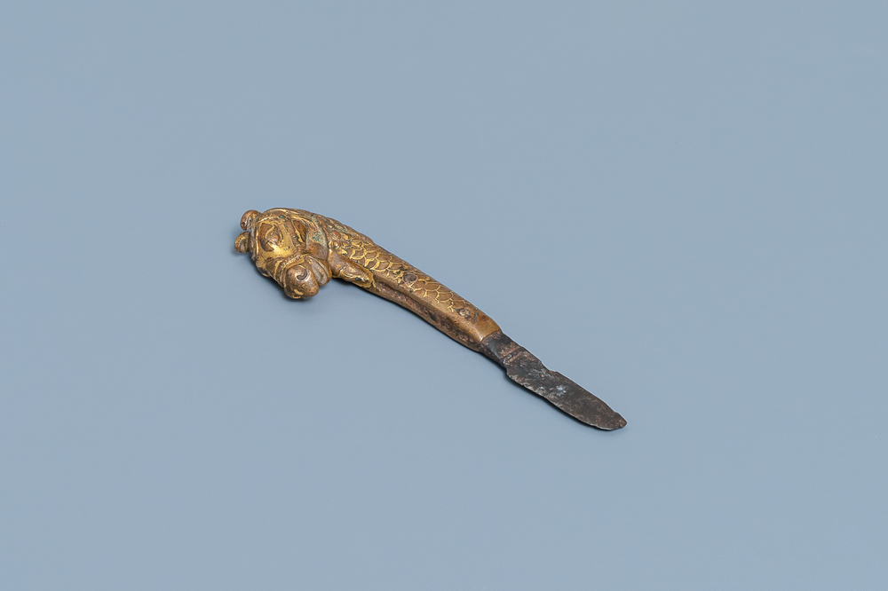 A Sino-Tibetan gilt bronze knife handle in the shape of a horse, Ming