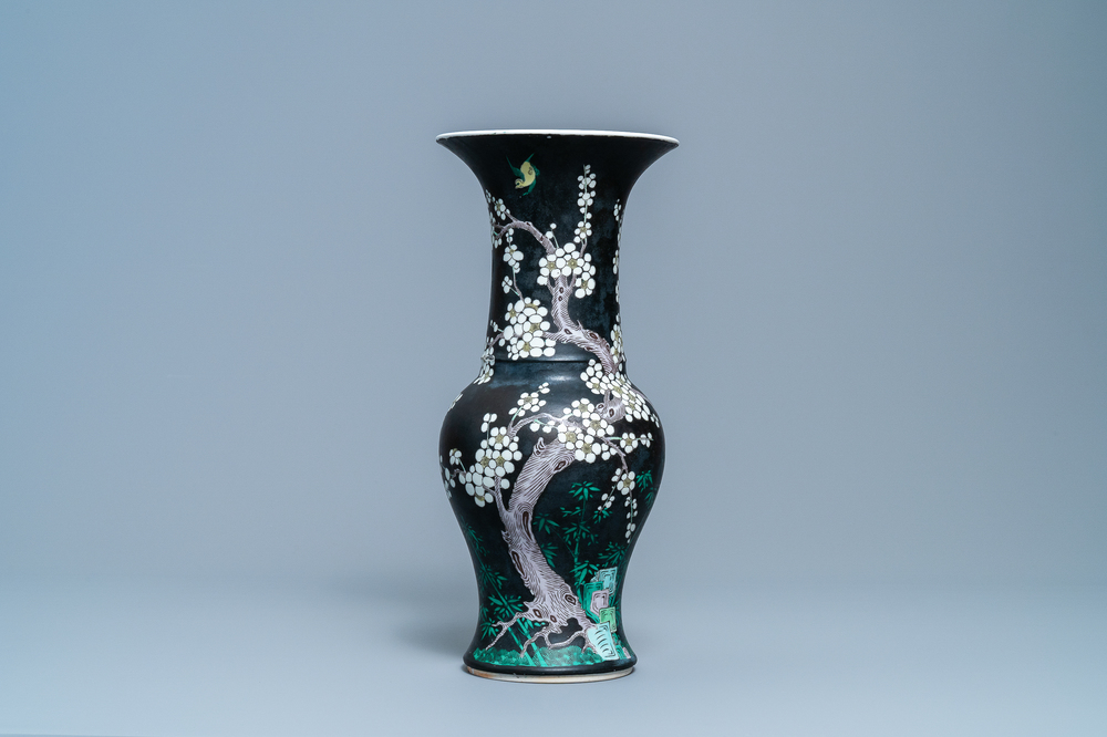 A Chinese famille noire 'magpie and prunus' yenyen vase, Kangxi