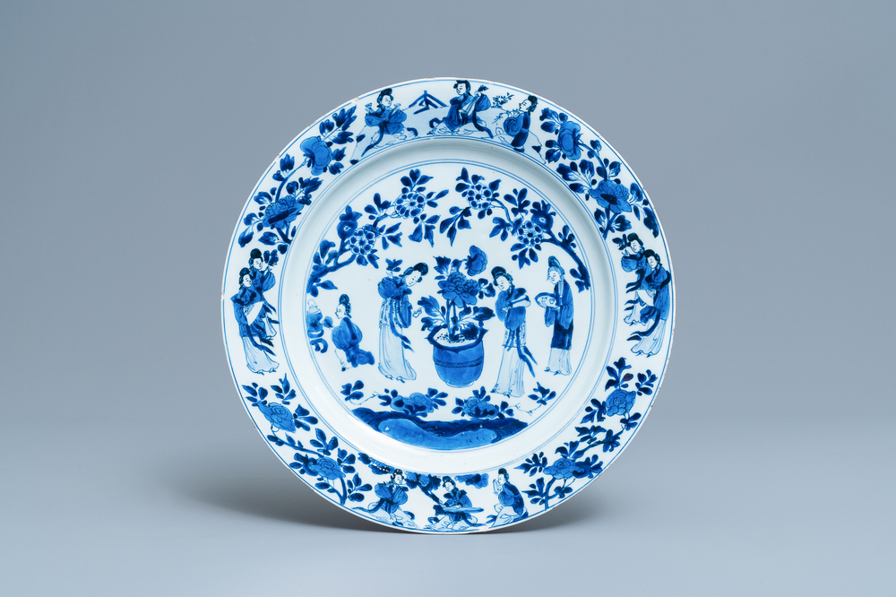 A Chinese blue and white dish with ladies around a jardini&egrave;re, Kangxi
