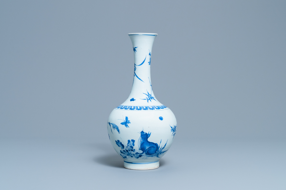 A rare Chinese blue and white bottle vase with a cat and a butterfly, Transitional period