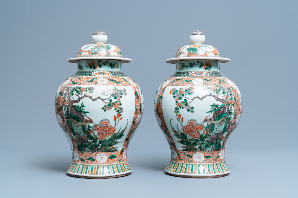 A pair of Chinese famille verte vases and covers, Kangxi mark, 19th C.